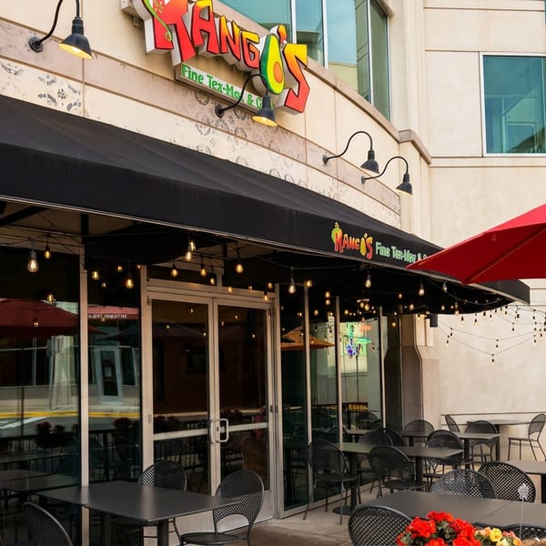 Exterior of Rango's Fine Tex-Mex & Grill with a black awning and outdoor patio seating.